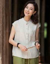 Women’s sleeveless button up casual shirt front view beige