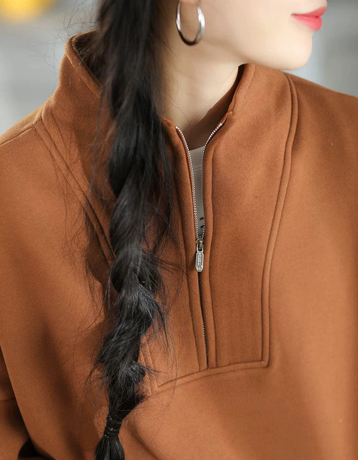 Relaxed-fit women's brown pullover sweatshirt with dropped shoulders and loose long sleeves