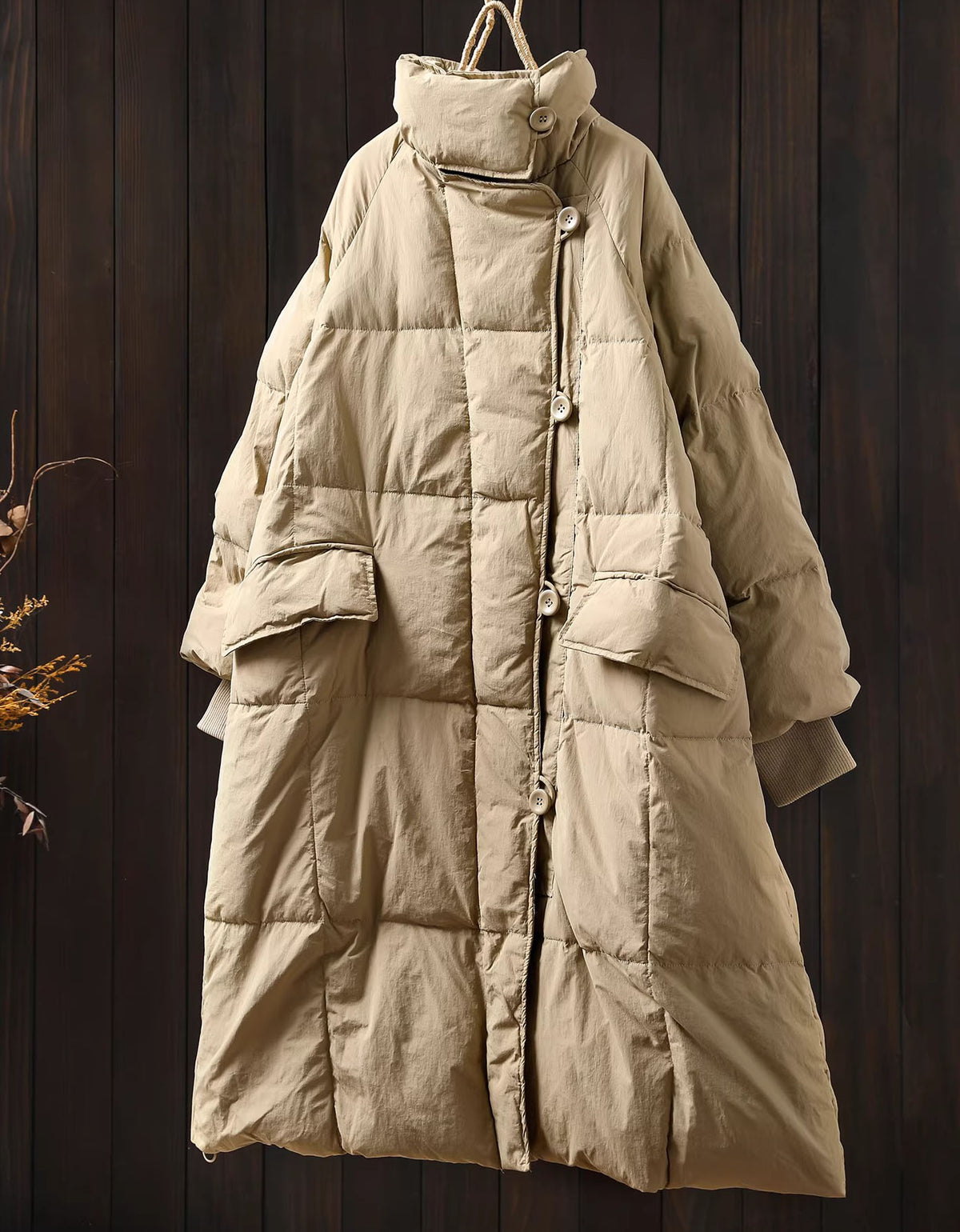 Full-length image of women’s khaki long puffer coat worn casually with everyday winter outfits