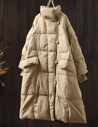 Full-length image of women’s khaki long puffer coat worn casually with everyday winter outfits