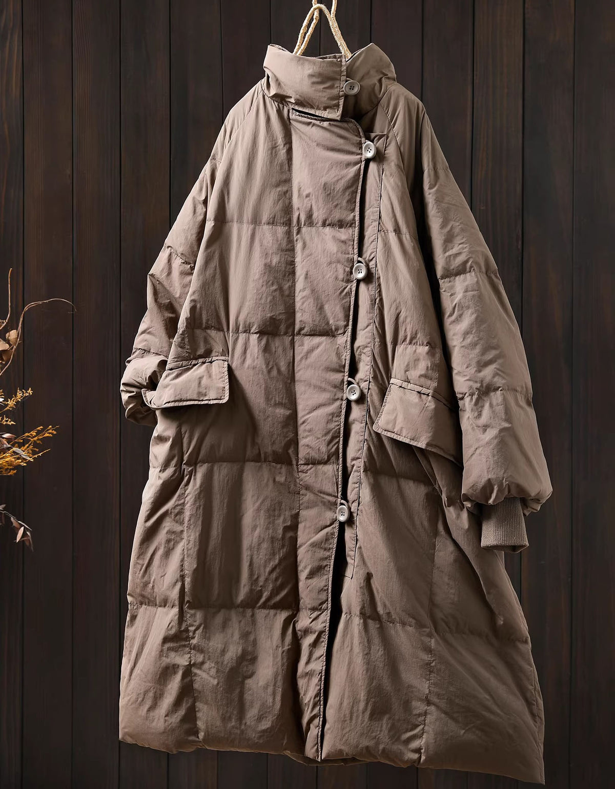 Full-length image of women’s coffee long puffer coat worn casually with everyday winter outfits