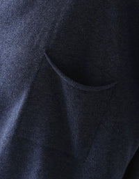 High turtleneck pocket detail on a brown women’s sweater