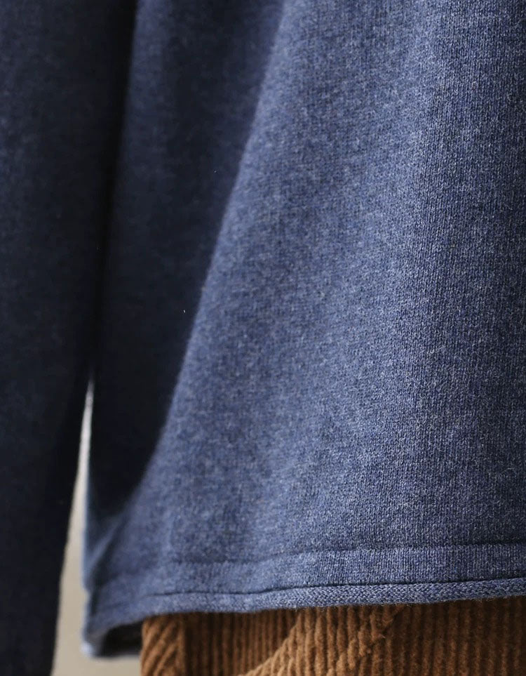 Long sleeves and relaxed silhouette of a blue casual sweater