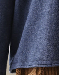 Long sleeves and relaxed silhouette of a blue casual sweater