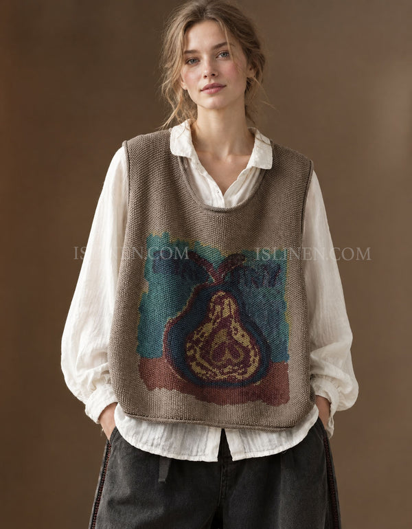 Women's taupe vintage pear graphic knit sweater vest layered over a white blouse