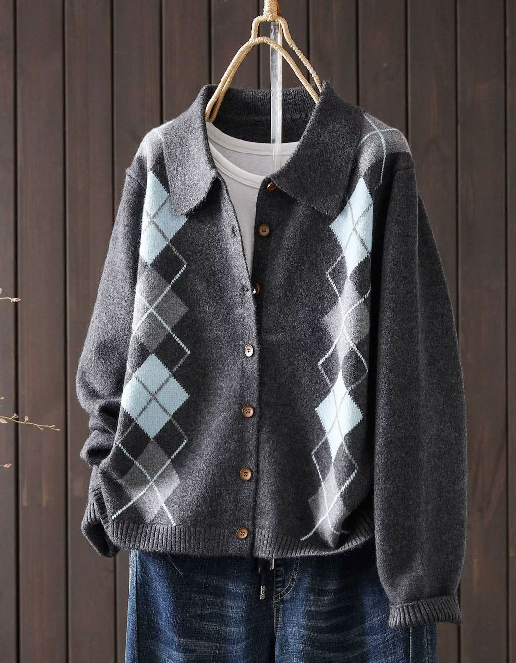Women's gray argyle knit cardigan with collar and brown buttons, front view