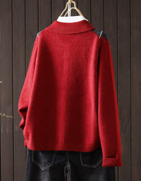 Back view of long sleeve of an red argyle cardigan with ribbed knit cuff detail