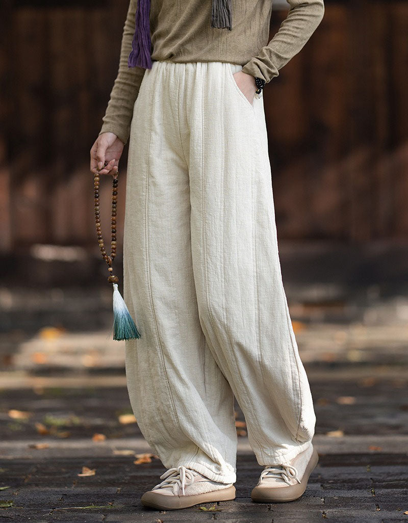 Gathered ankle cuffs on women's linen balloon trousers with a relaxed fit