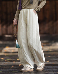 Gathered ankle cuffs on women's linen balloon trousers with a relaxed fit