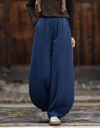 Women's loose fit navy harem pants with elastic waistband and gathered ankle cuffs