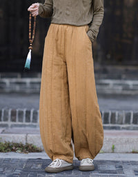 Women's loose fit yellow harem pants with elastic waistband and gathered ankle cuffs