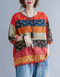 Front view of women’s boho floral top and embroidered denim pants, showcasing the relaxed fit