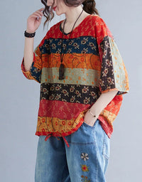 Side view of women’s boho floral top and embroidered denim pants, showcasing the relaxed fit